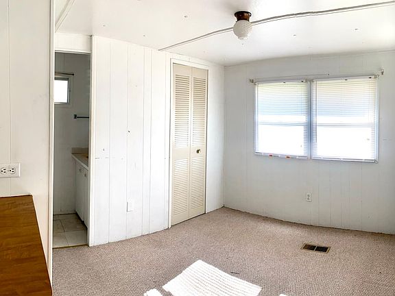 Master bedroom with door leading into the bathroom