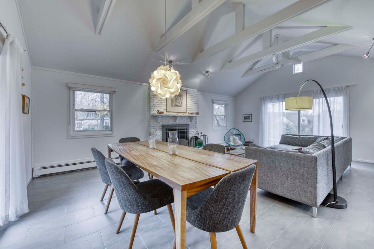 Dining area leads to the back patio bbq area .