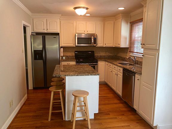 Kitchen with stainless steel appliances, granite countertops