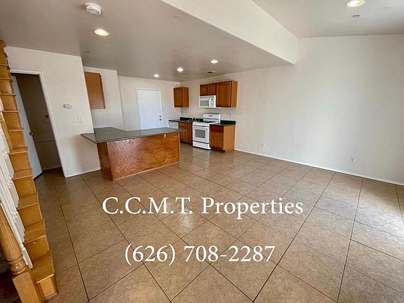 kitchen, living room, and door to the .5 bathroom