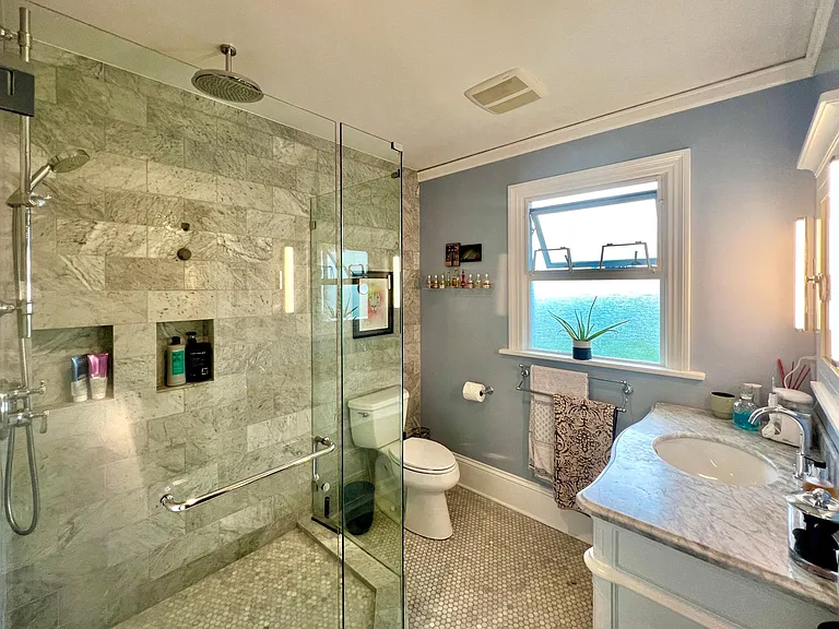 Master Bath with Hans Groche rain shower, heated floors, and Italian marble.
