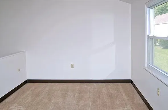 One Primary Bedroom with loft overlooking first floor below.