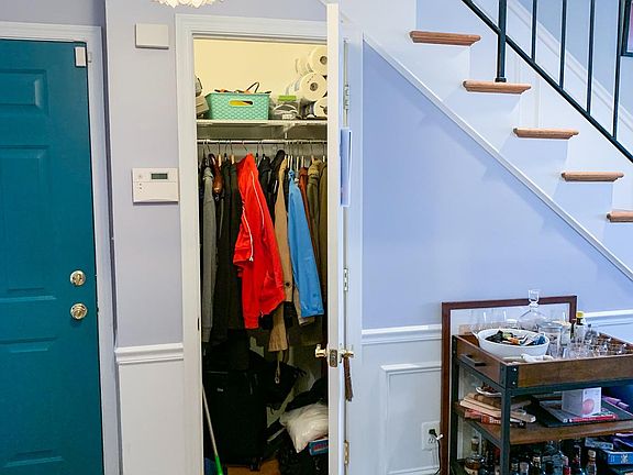 Closet extends under the stairwell