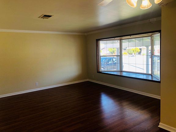 This is the guest receiving room with an abundance of light and a beautiful bay window. Set your formal dining and show your rich sofa set and interior decor talents.