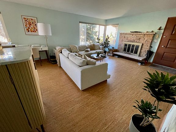 Spacious living room with cork floors.