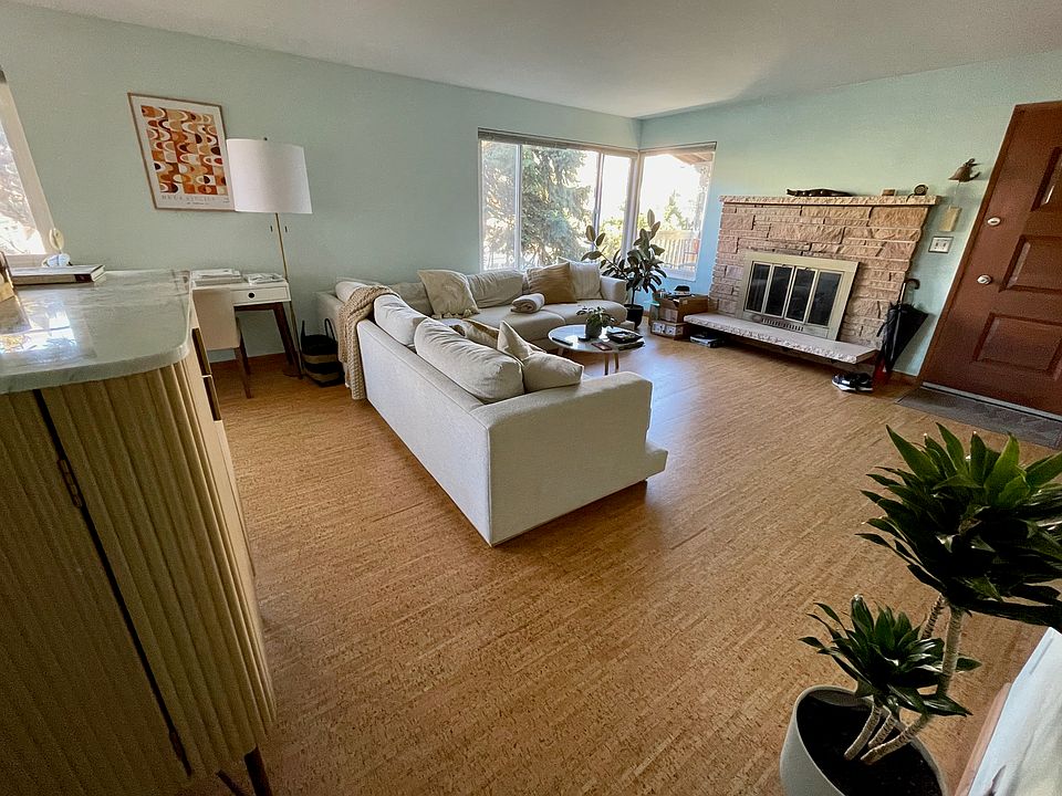 Spacious living room with cork floors.