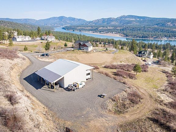 1200 sq. foot shop with overhead lighting, an additional 12x40 covered RV parking area.