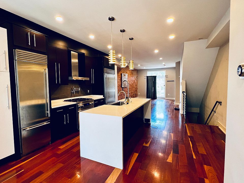 Spacious open floor plan comprised of dining, kitchen, and living rooms. 9 foot ceilings add to the expansive feel