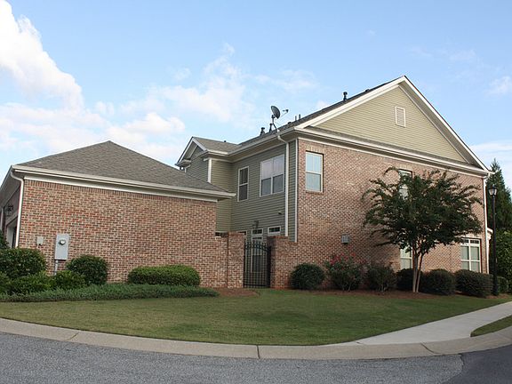 Side view / Patio entry
						:
						Side yard and Private Patio
Attached 2 Car Garage easy access with Rear Street.