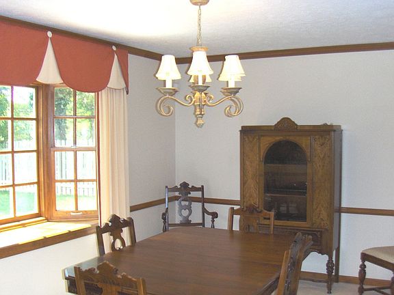 Formal DR features one of 3 of the custom bay windows along w/crown molding.