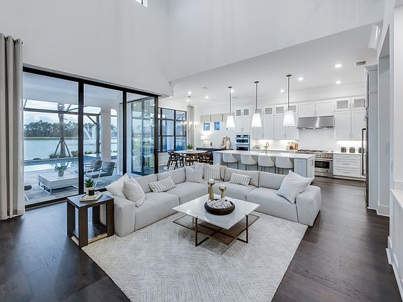 Stately gathering room with zero-corner sliding glass door to outdoor living space