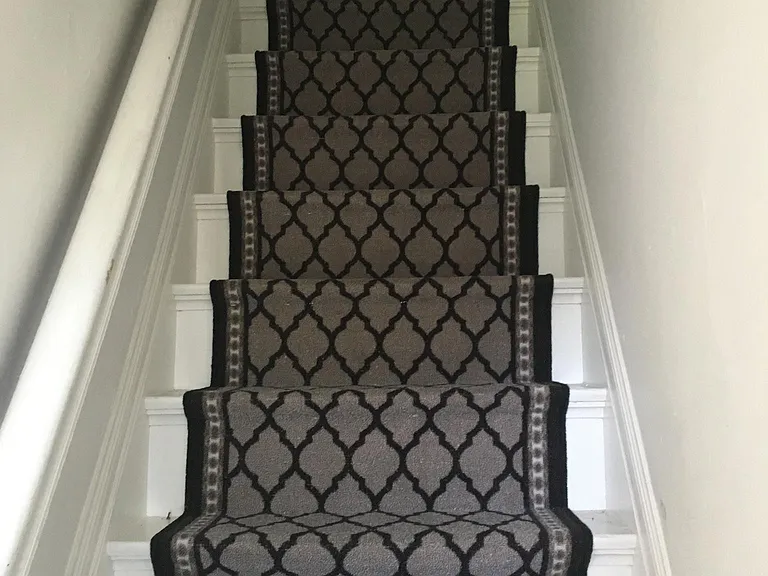 Stairs lead to two bedrooms on the second floor.