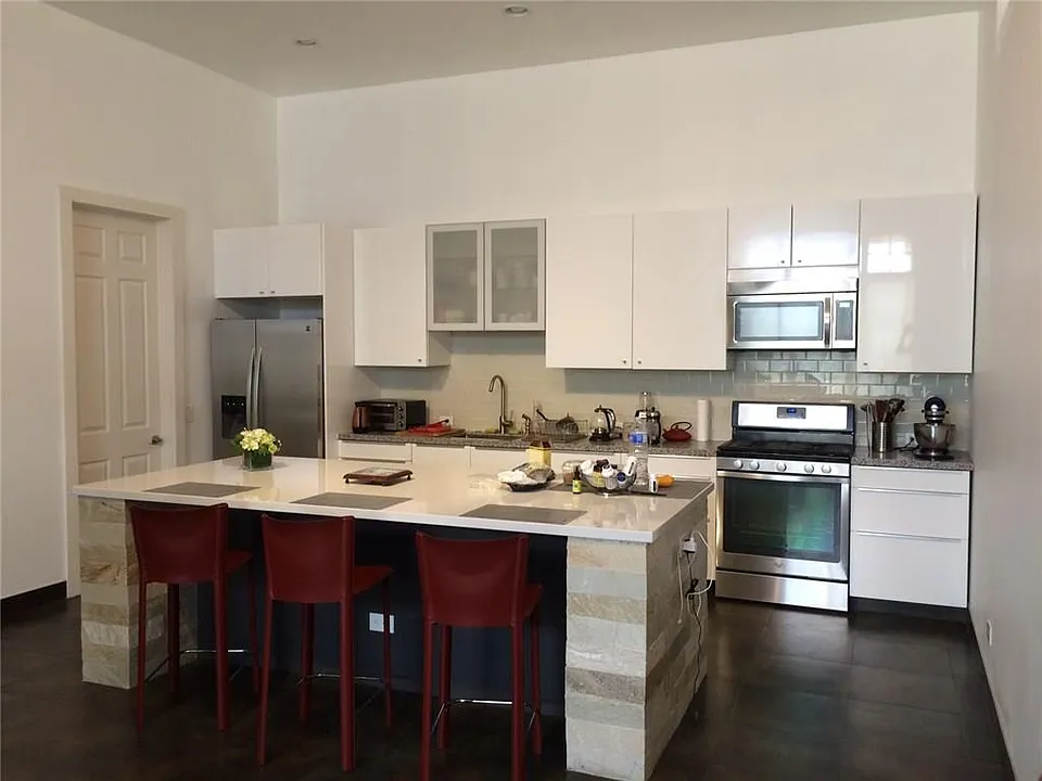 Eat in kitchen with stainless appliances and beautiful island.