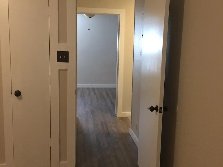 View of hallway between bedrooms.