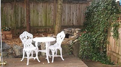 Deck and patio area with water feature.