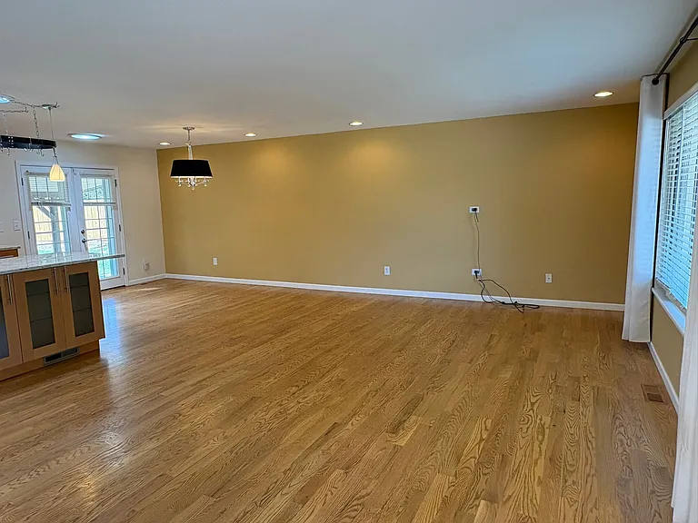 Walking in through the front door, you're greeted with a spacious living area, open kitchen, and a dining area. Large (new) front window lets in lots of south facing light