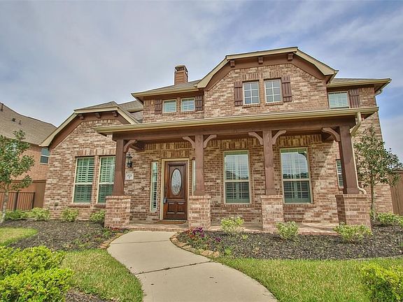 Grand Porch Across Front Of Home With Lead Glass Front Door.