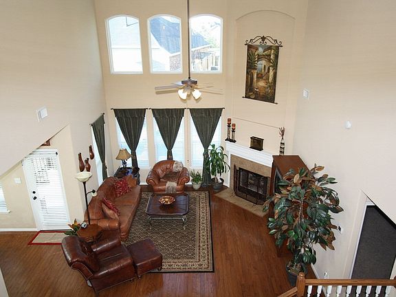 Soaring ceilings in the den with a view and gleaming wood floors.