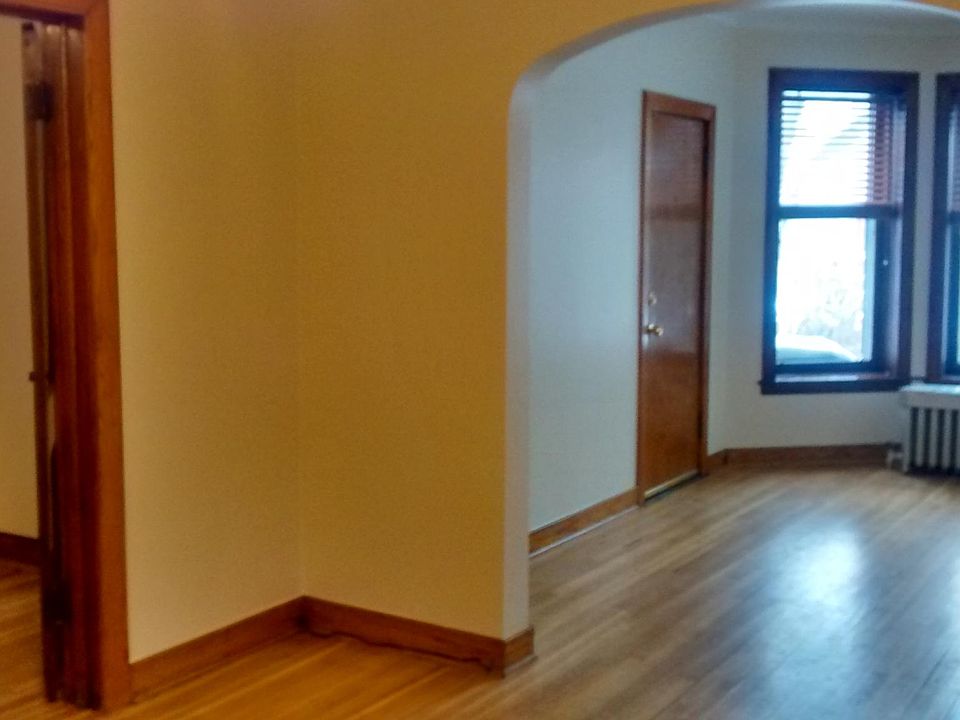 Living room, bay window and first bedroom