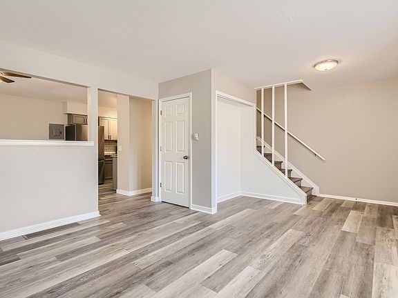 Spacious main floor with living room, dining room, kitchen, and 1/2 bath.
