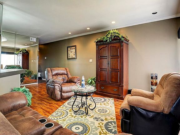 Living room is large enough for over sized furniture.