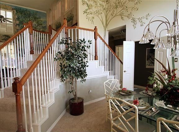 dual staircase -one to entry and one to kitchen