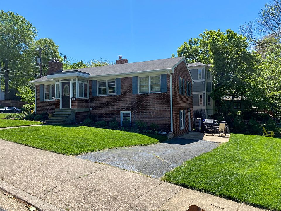 Front of house viewed from sidewalk/street. Private entrance off of concrete patio (right side of house).
