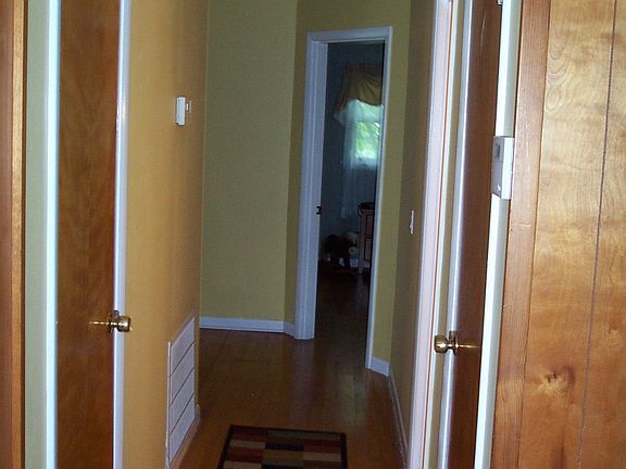 Hall way to 3 bedrooms