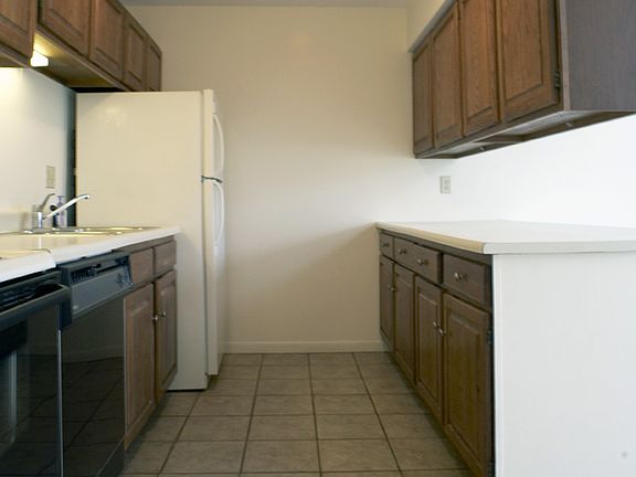 Enjoy cooking? Kitchen features beautiful terra cotta tiles and plenty of cabinet space
