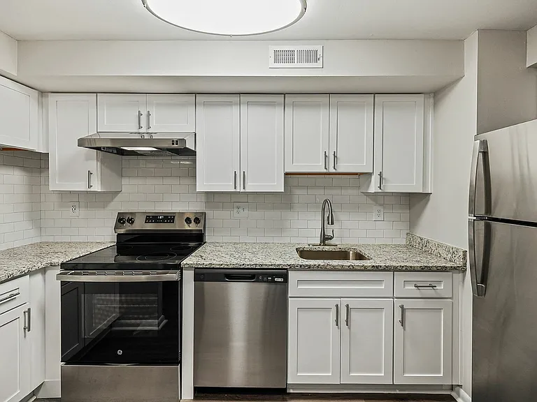 Experience culinary bliss in this sleek, modern kitchen designed for efficiency and style.