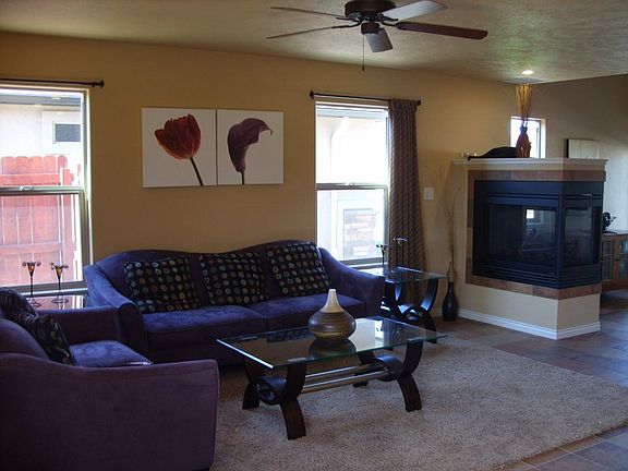 Living Room with 3 Sided Fireplace, Loft/Den/Office Area is Upstairs