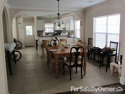 Dining and Kitchen
						:
						Open dining and kitchen area with tile floor