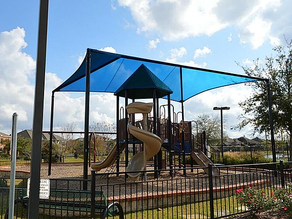  WHAT FUN! A Covered Playground for the Kids Right Here in the Neighborhood!