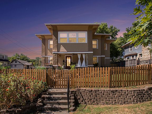 Front view of home with private fenced yard