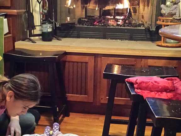 Wood fireplace in dining roo