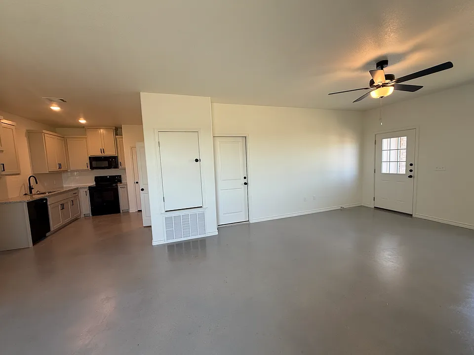 Living room area- connected to the kitchen and garage
