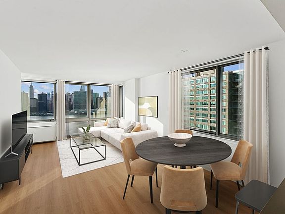 Renovated Package I dining and living room with hard-surface flooring
