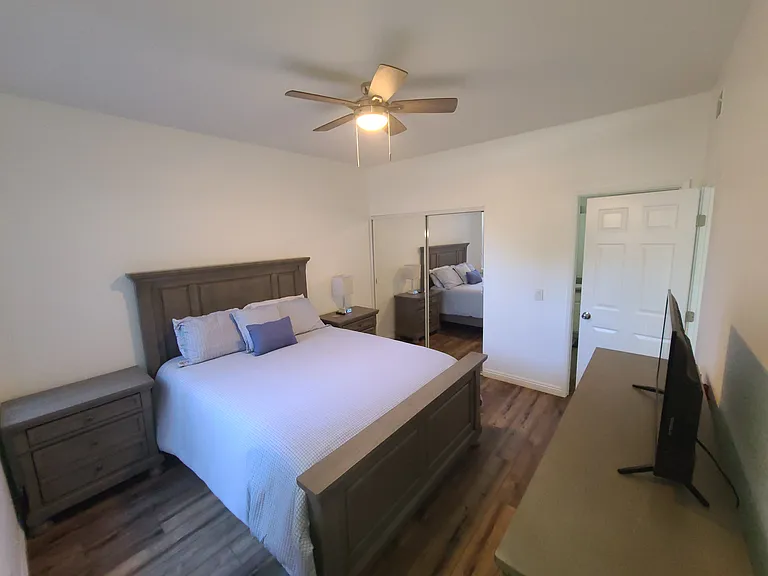 Spacious bedroom with direct access to the hall bathroom_offering the privacy and comfort of an en suite experience. _____