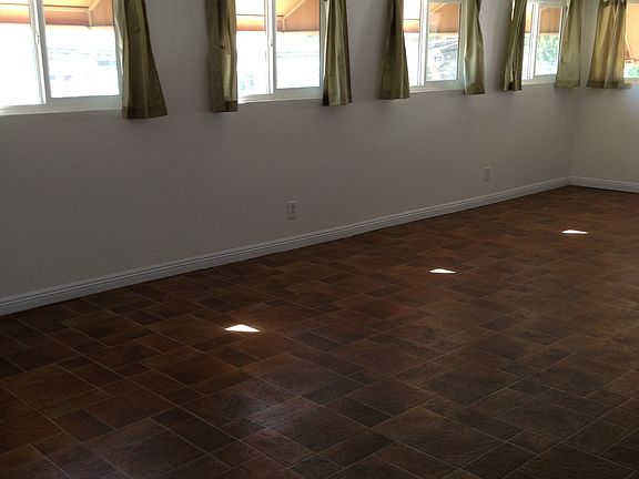 Left side of bonus room, patio off to the left with w/d hook