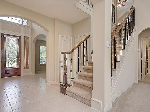Beautiful molding around the entry door gives the home a sophisticated feel and streams of sunshine flow through the over-sized foyer window.