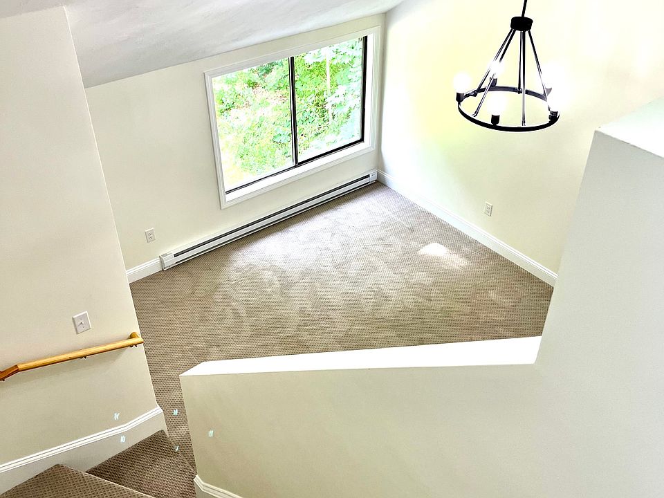 Bright and Sunny LARGE Main Bedroom with Vaulted Ceilings, Chandelier, and Staircase to Loft.