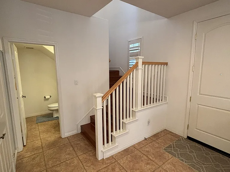 front door entry/ half a bath stairs to the 2nd floor