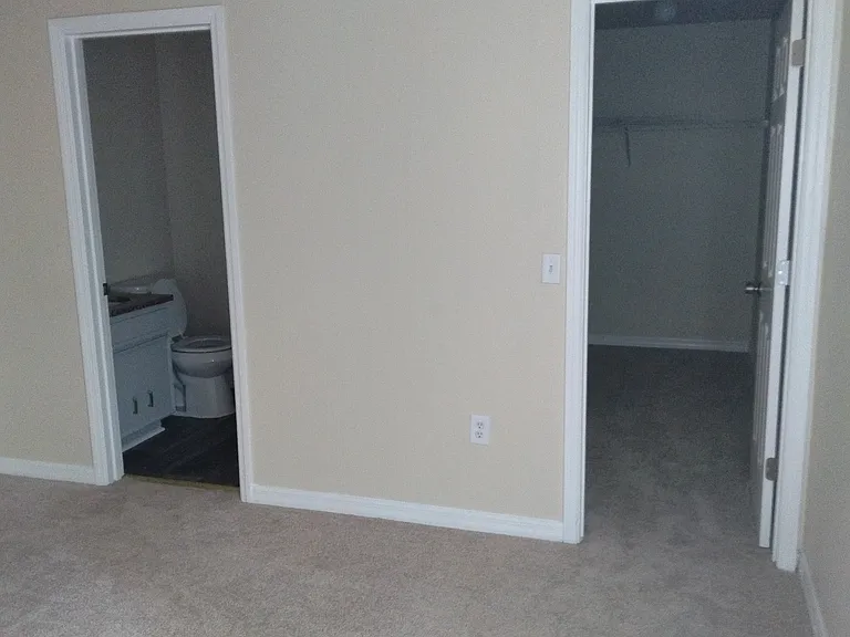 The walk-in closet in this master bedroom can also be used as a office.