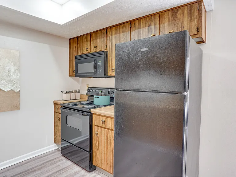Step into stylish living at Tipton Terrace! This modern kitchen boasts sleek appliances and ample storage, perfect for culinary enthusiasts. Don't miss your chance to call this place homeAAAaA"schedule a tour today!