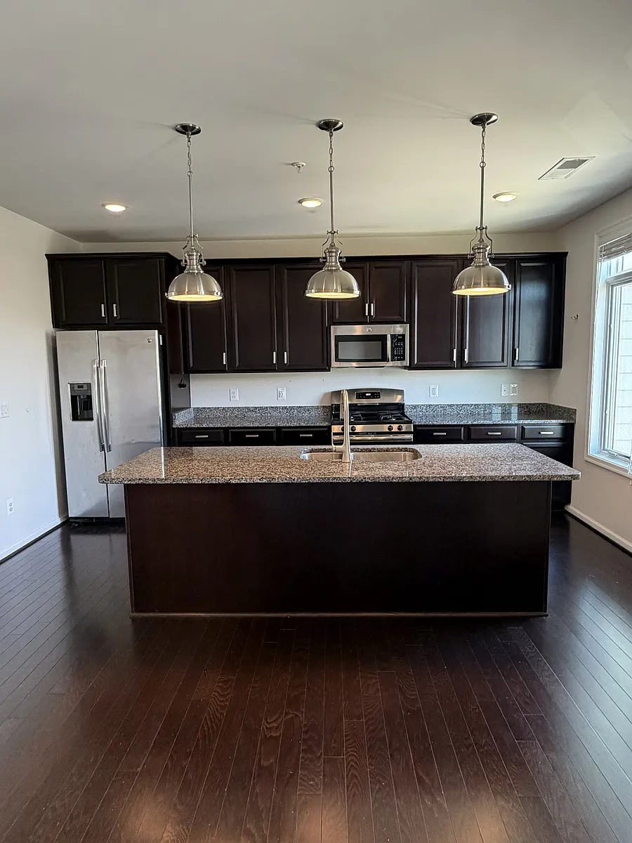 Well-appointed Kitchen with island. - 1426 Ribbon Limestone Ter SE