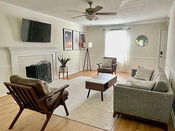 Living room with wood burning fireplace