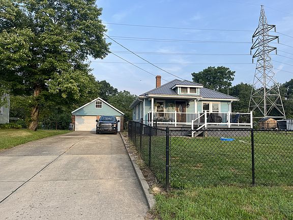 Front of house, large 2 bay detached garage, private fenced in yard
