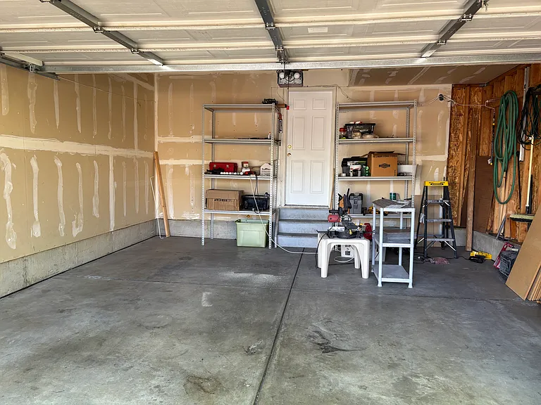 2-car garage with shelves