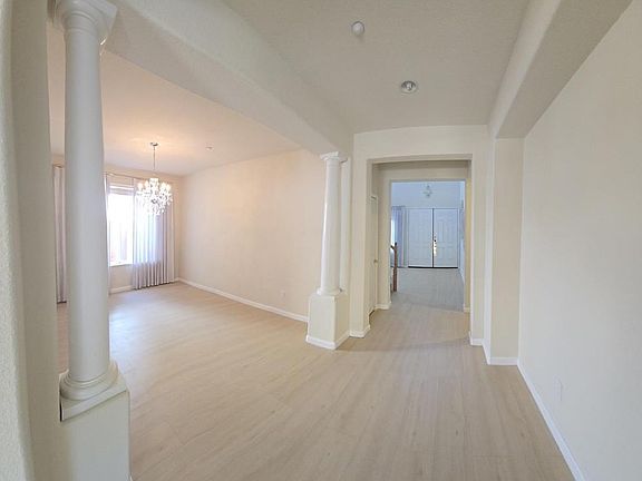 Extended Entry Leading to Living Room and Formal Dining Room