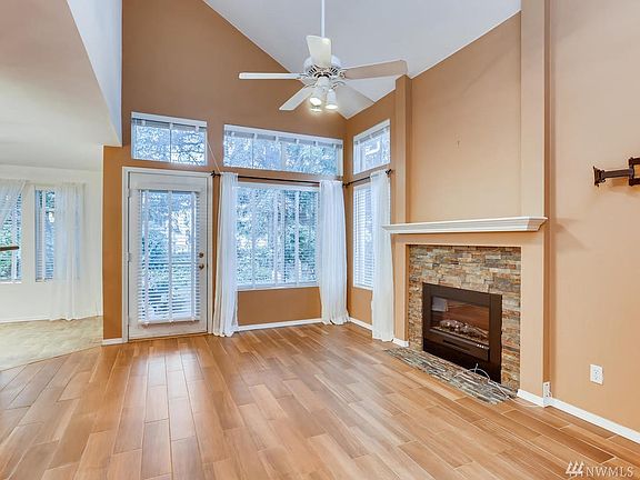 Huge Family room off kitchen area. Enjoy the vaulted ceilings, fireplace and radiant heated floors.